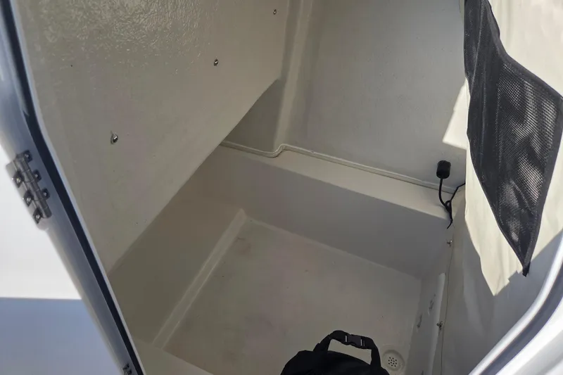Slide: The Image of Interior storage compartment of 2026 Sea Fox 248 Commander boat, featuring a netted pocket. - 13
