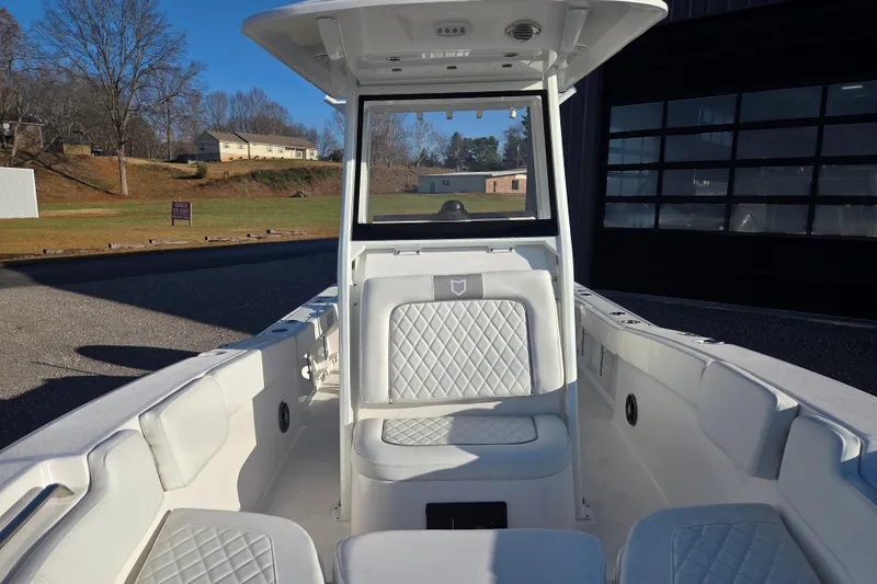 Slide: The Image of 2026 Sea Fox 248 Commander boat interior with white seating and console. - 4