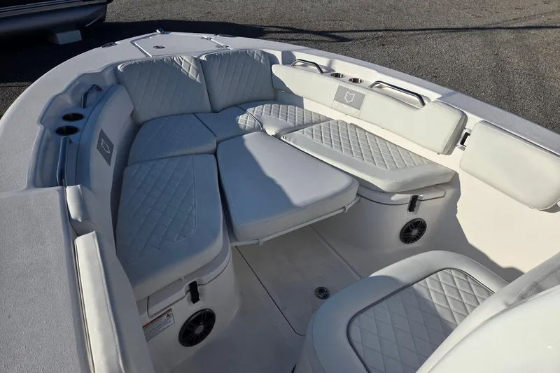 Slide: The Image of 2026 Sea Fox 248 Commander boat interior with cushioned seating and cup holders. - 5
