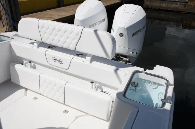 Slide: The Image of White Limitless 270 boat interior with dual Mercury engines, 2026 model. - 18