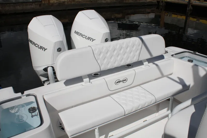 Slide: The Image of Limitless 270 boat with dual Mercury engines, featuring sleek white seating, 2026 model. - 19