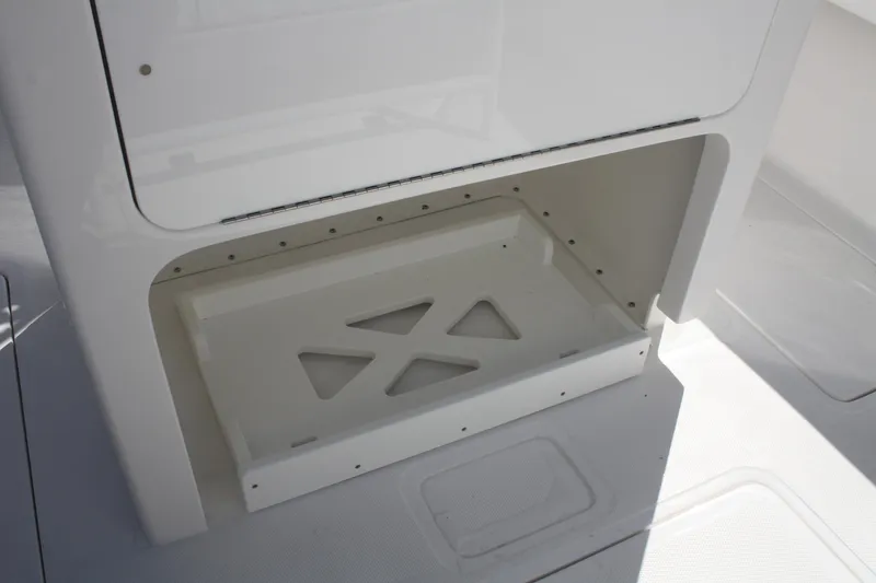 Slide: The Image of Interior storage compartment of Limitless 270 boat, 2026 model, featuring sleek design. - 25