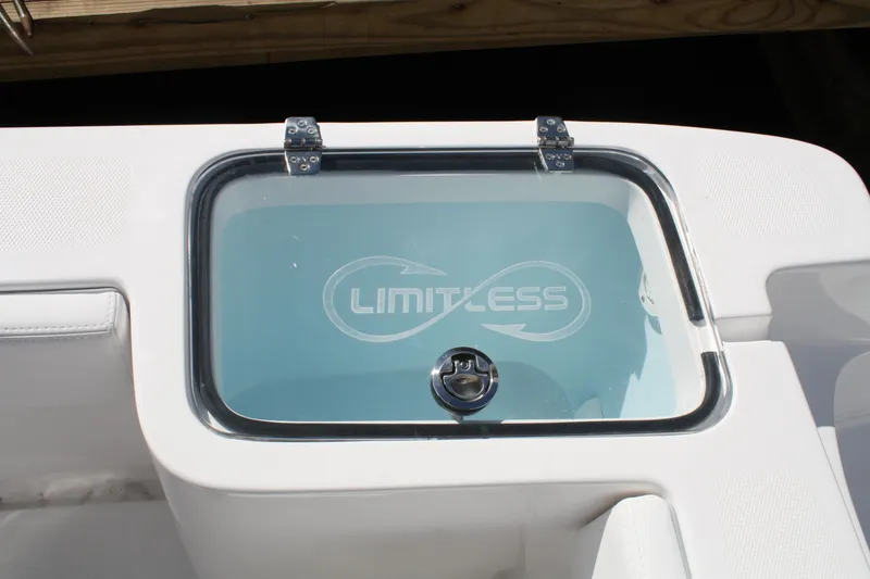 Slide: The Image of Limitless 270 boat livewell with logo, 2026 model, featuring sleek design and secure latch. - 26