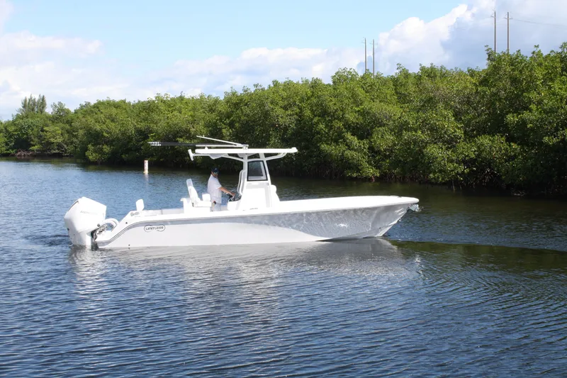 Slide: The Image of 2026 Limitless 270 boat cruising on a calm river with lush greenery. - 36