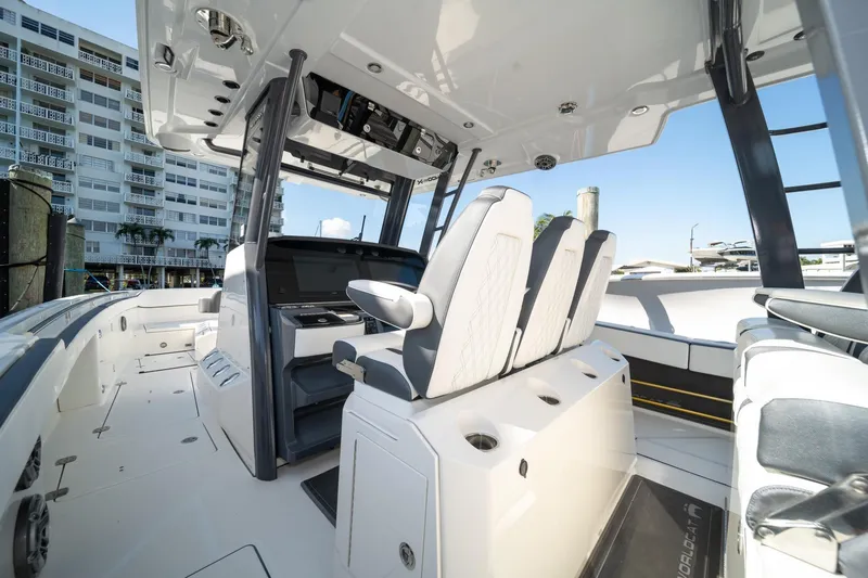Slide: The Image of 2022 World Cat 400 CC-X boat interior with modern seating and control panel. - 24
