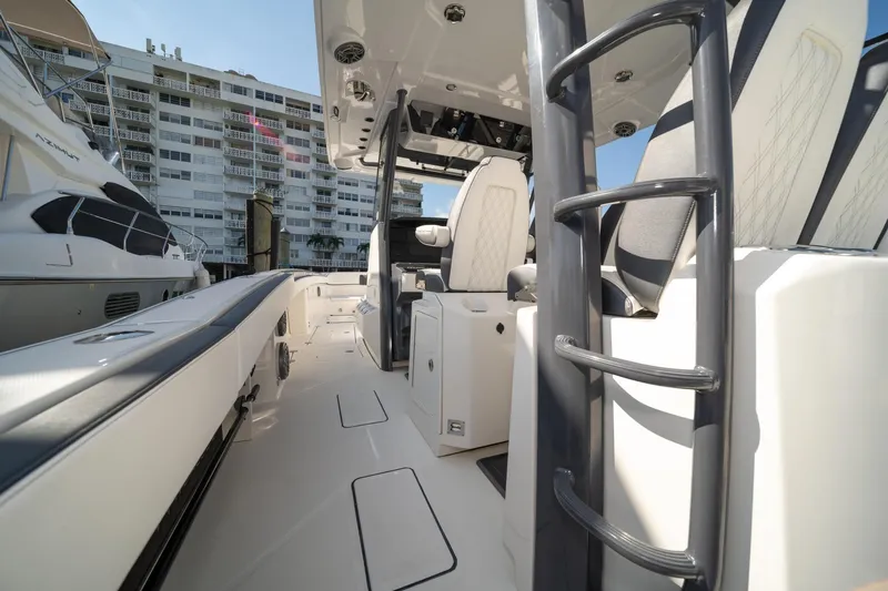 Slide: The Image of 2022 World Cat 400 CC-X boat interior with modern seating and sleek design. - 27