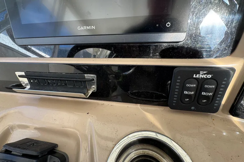 Slide: The Image of 2019 Robalo R272 Center Console dashboard with Garmin display and Lenco controls. - 16