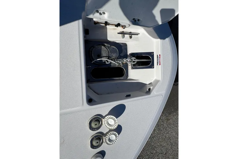 Slide: The Image of 2019 Robalo R272 Center Console boat anchor compartment and fittings. - 21