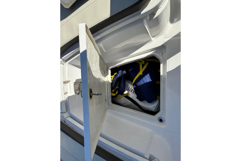 Slide: The Image of Open storage compartment on 2019 Robalo R272 Center Console boat. - 22