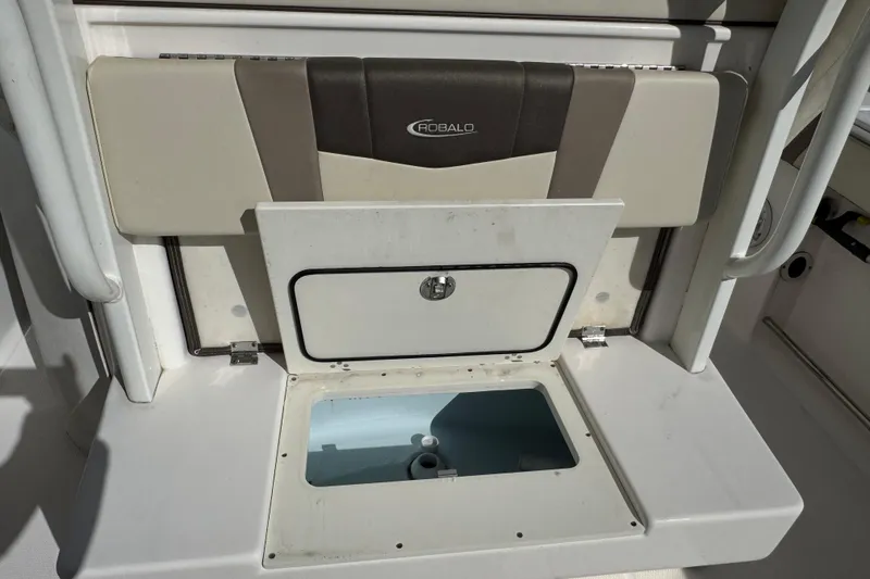 Slide: The Image of 2019 Robalo R272 Center Console boat storage compartment with open hatch. - 5