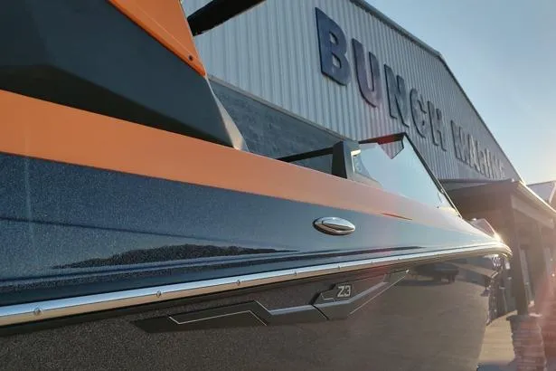 Slide: The Image of 2026 Tigé Z3 boat with sleek design, parked near a building under sunlight. - 15