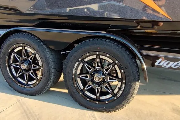 Slide: The Image of 2026 Tigé Z3 trailer with stylish black alloy wheels and rugged tires. - 16