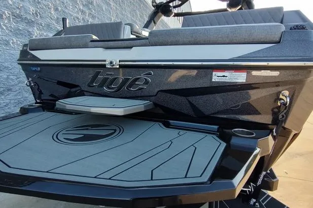 Slide: The Image of 2026 Tigé Z3 boat rear view with swim platform and sleek design. - 20