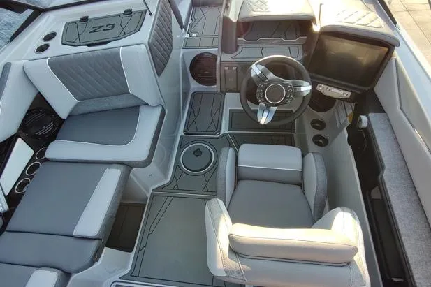 Slide: The Image of 2026 Tigé Z3 boat interior with modern seating, steering wheel, and dashboard design. - 6