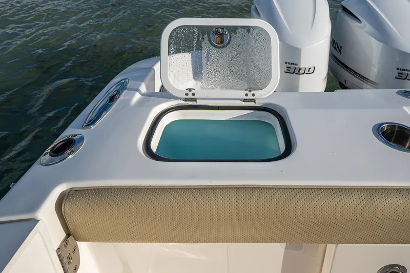 Slide: The Image of 2019 Pursuit DC 365 Dual Console boat with open livewell and twin Yamaha 300 engines. - 17