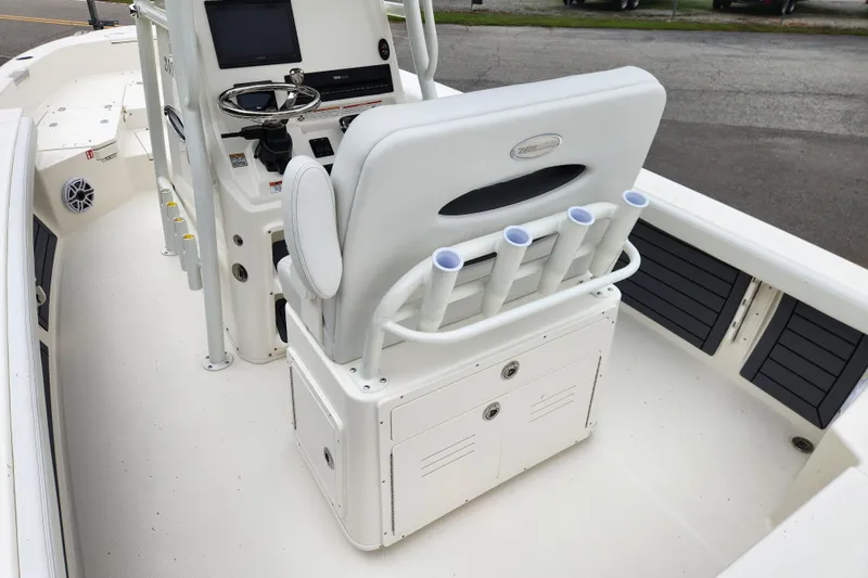 Slide: The Image of 2026 Pathfinder 2400 TRS boat interior with helm, rod holders, and storage compartments. - 13