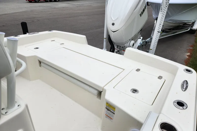 Slide: The Image of 2026 Pathfinder 2400 TRS boat with Yamaha outboard motor, docked on trailer. - 14
