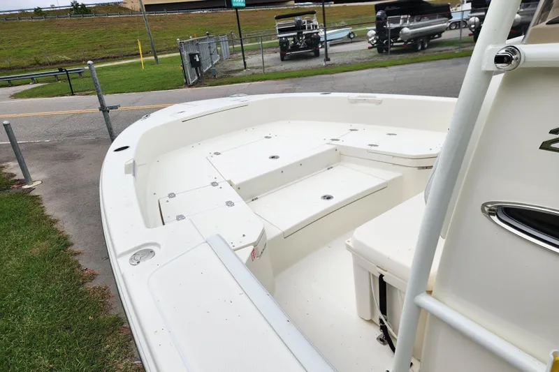 Slide: The Image of 2026 Pathfinder 2400 TRS boat interior with spacious seating and storage compartments. - 7