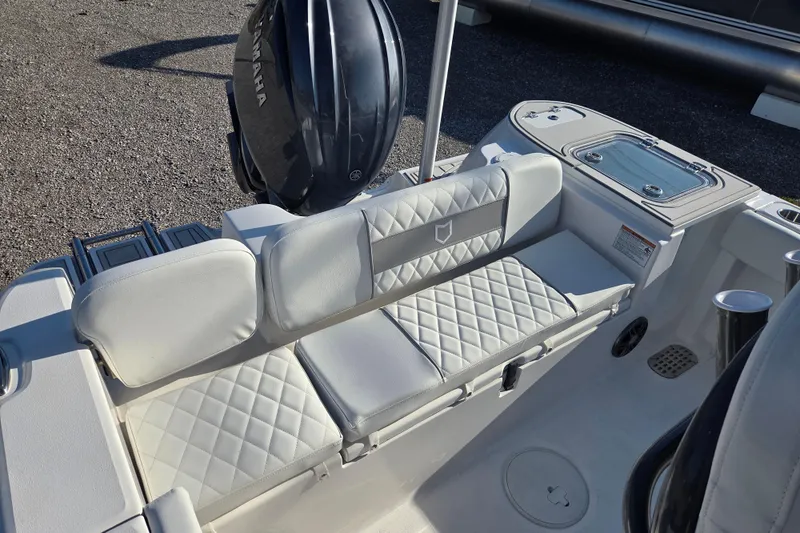 Slide: The Image of 2026 Sea Fox 228 Commander boat interior with cushioned seating and Yamaha engine. - 13