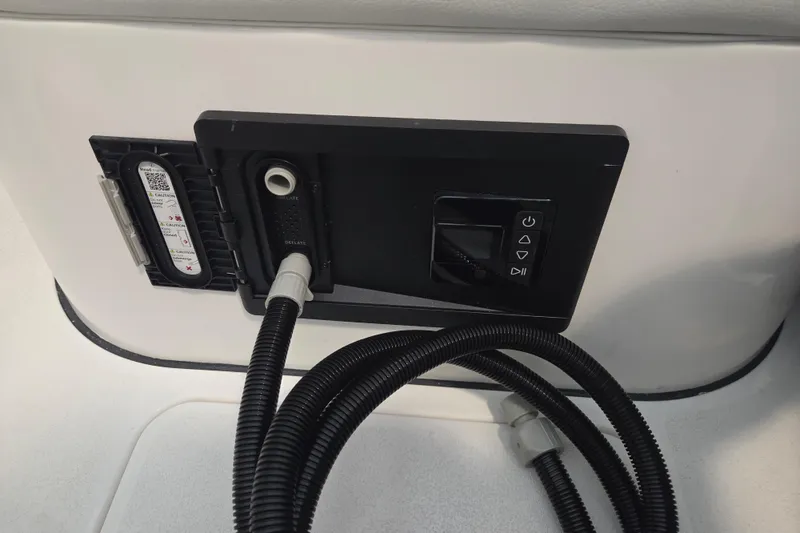 Slide: The Image of Control panel on 2026 Sea Fox 228 Commander boat with attached hoses. - 15