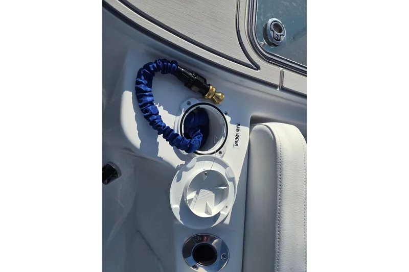 Slide: The Image of 2026 Sea Fox 228 Commander boat interior with raw water hose and seating detail. - 17
