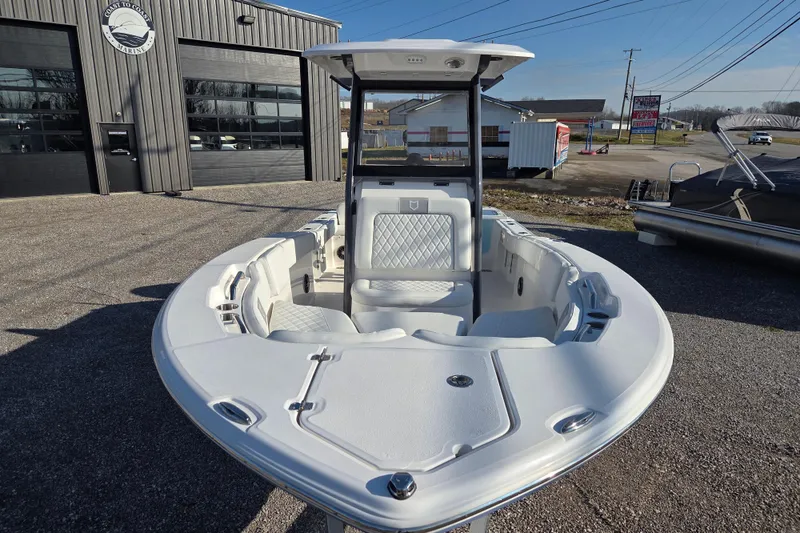 Slide: The Image of 2026 Sea Fox 228 Commander boat displayed outdoors at a marina. - 4