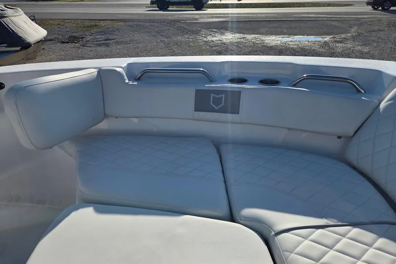 Slide: The Image of Interior seating of 2026 Sea Fox 228 Commander boat with white upholstery and cup holders. - 6