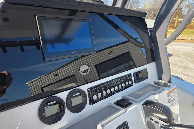 Slide: The Image of 2026 Sea Fox 228 Commander dashboard with Garmin display and Yamaha controls. - 8
