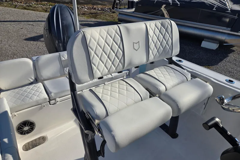 Slide: The Image of 2026 Sea Fox 228 Commander boat interior with white cushioned seating. - 9
