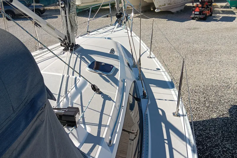 Slide: The Image of 2020 Catalina 315 sailboat deck view in a boatyard. - 2