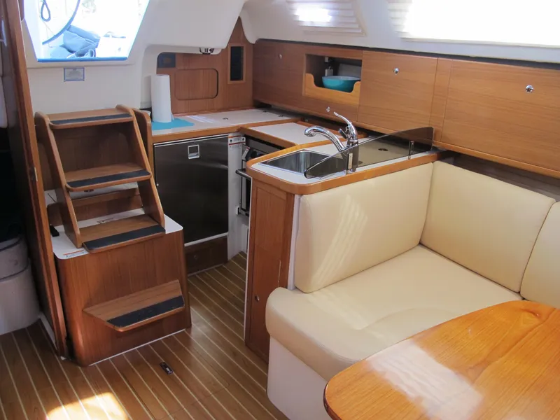 Slide: The Image of Interior of 2020 Catalina 315 sailboat with kitchen, sink, and seating area. - 25
