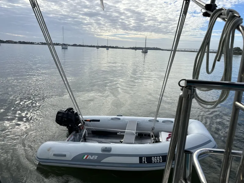 Slide: The Image of Inflatable boat on calm water, viewed from a 2020 Catalina 315 sailboat. - 31