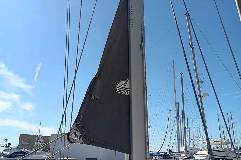 Slide: The Image of Close-up of a 2020 Catalina 315 sailboat mast and sail at a marina. - 8