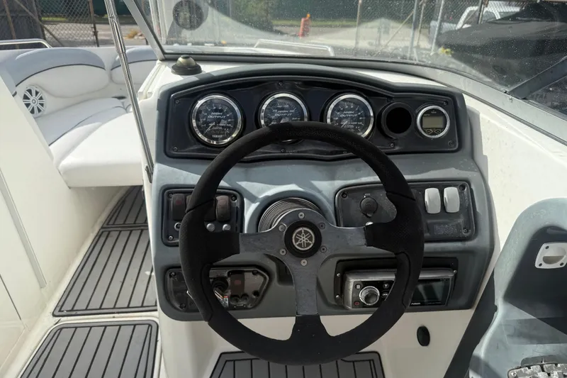 Slide: The Image of 2009 Yamaha Boats AR230 HO dashboard with steering wheel and instrument panel. - 2