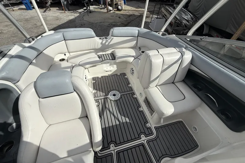Slide: The Image of 2009 Yamaha Boats AR230 HO interior with white seating and gray flooring. - 3