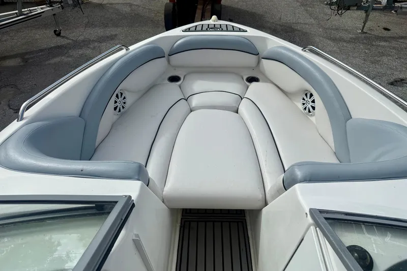 Slide: The Image of 2009 Yamaha Boats AR230 HO interior with cushioned seating and speakers. - 5
