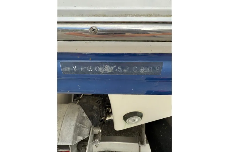 Slide: The Image of 2009 Yamaha Boats AR230 HO hull identification number on blue and white surface. - 8