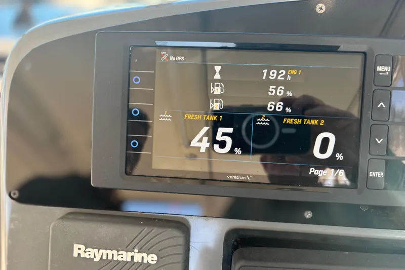 Slide: The Image of 2000 Pursuit 3400 Express boat docked by palm trees under clear blue sky. - 13