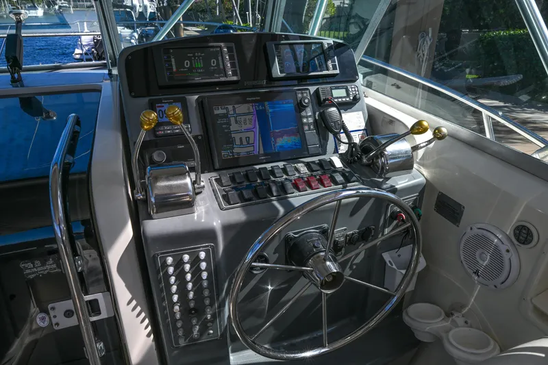 Slide: The Image of Control panel of a 2000 Pursuit 3400 Express boat with navigation equipment. - 36