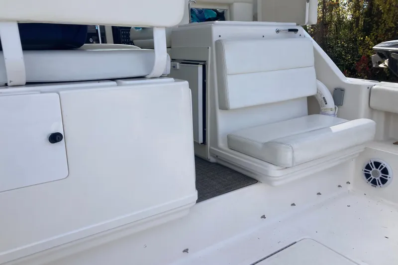 Slide: The Image of Cockpit seat to stbd and wet bar w/refrigerator behind - 30