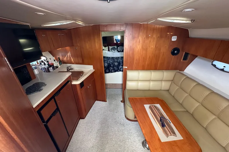 Slide: The Image of 1999 Tiara Yachts 3500 Open boat on dry land, side view. - 4