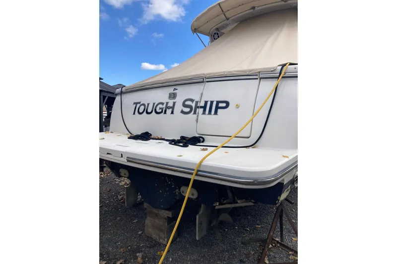 Slide: The Image of 1999 Tiara Yachts 3500 Open boat named "Tough Ship" on dry dock. - 40