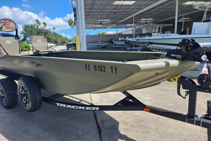 Slide: The Image of 2025 Tracker Grizzly 1650 T Prairie Wings Edition boat on trailer at Bass Pro Shops. - 10