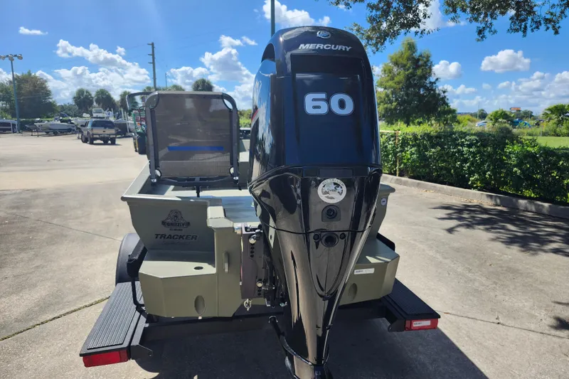 Slide: The Image of 2025 Tracker Grizzly 1650 T Prairie Wings Edition with Mercury 60 engine in parking lot. - 3