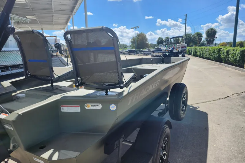 Slide: The Image of 2025 Tracker Grizzly 1650 T Prairie Wings Edition boat on trailer, outdoor setting. - 5