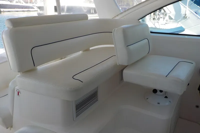 Slide: The Image of 2009 Tiara Yachts 3900 Open interior seating with white upholstery and blue accents. - 17