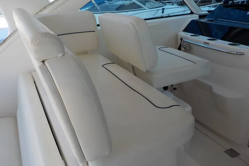 Slide: The Image of 2009 Tiara Yachts 3900 Open interior seating with white upholstery and sleek design. - 18