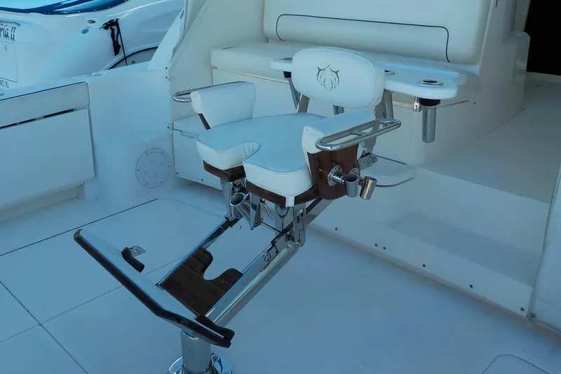 Slide: The Image of 2009 Tiara Yachts 3900 Open fishing chair on deck, featuring white upholstery and metal accents. - 21