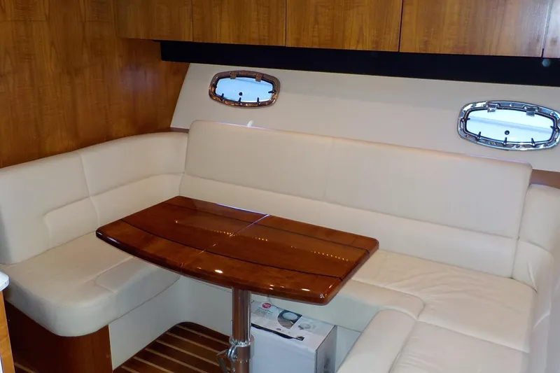 Slide: The Image of Luxurious interior of 2009 Tiara Yachts 3900 Open with elegant seating and wooden table. - 24
