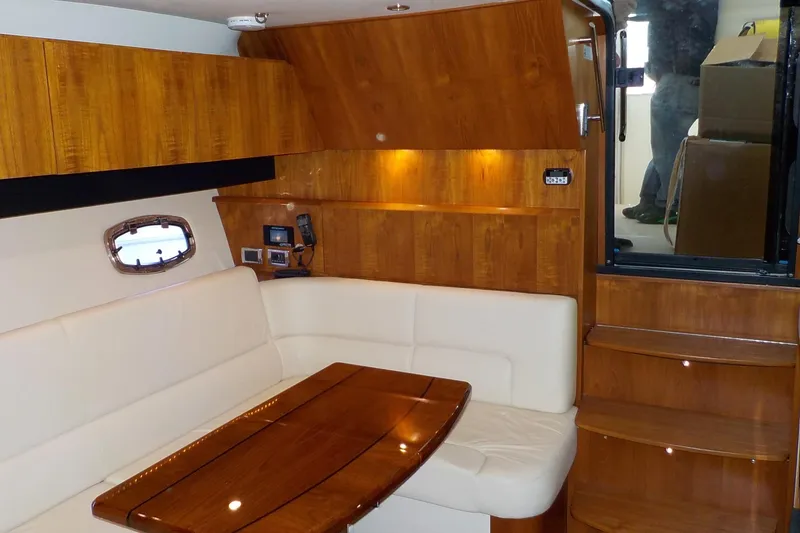 Slide: The Image of Luxurious interior of 2009 Tiara Yachts 3900 Open with wood finish and plush seating. - 26